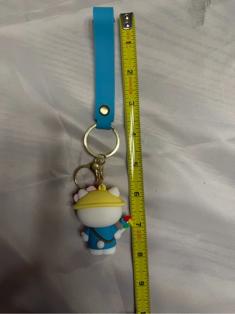 Hello Kitty Blue Outfit with pinwheel. Keychain/ wristlet.